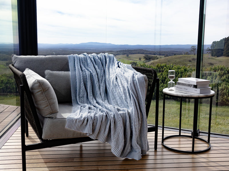 Organic cotton light blue throw in chair