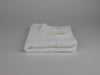 Organic cotton hand towel folded in white