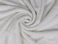 Organic cotton luxury bath towel bundle close up in white